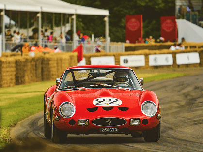 Classic car driving on mountain road